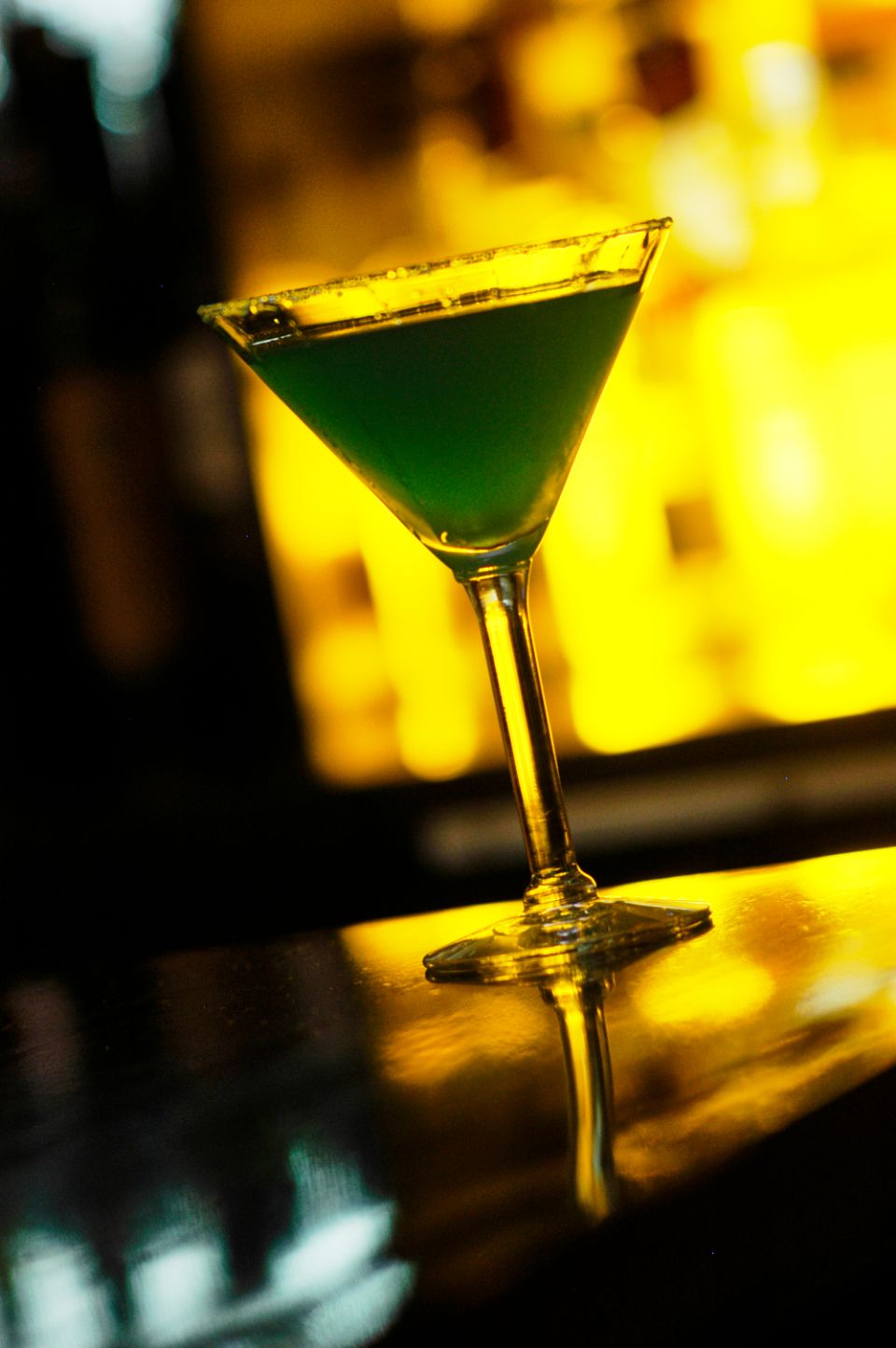 A cocktail being finished at the bar