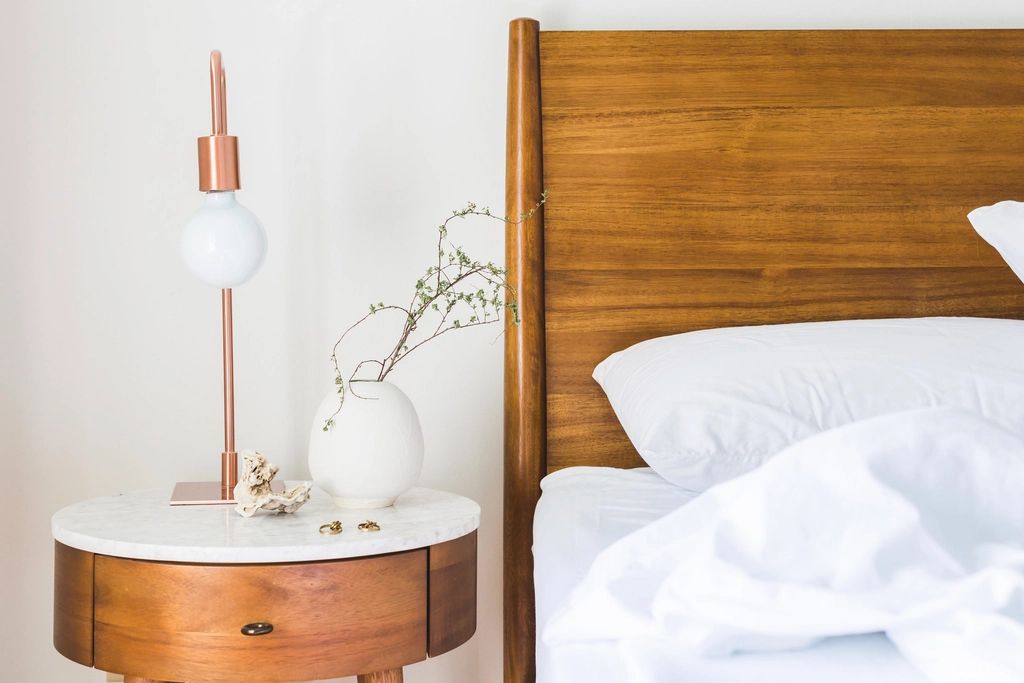 A guest room with two beds and a window